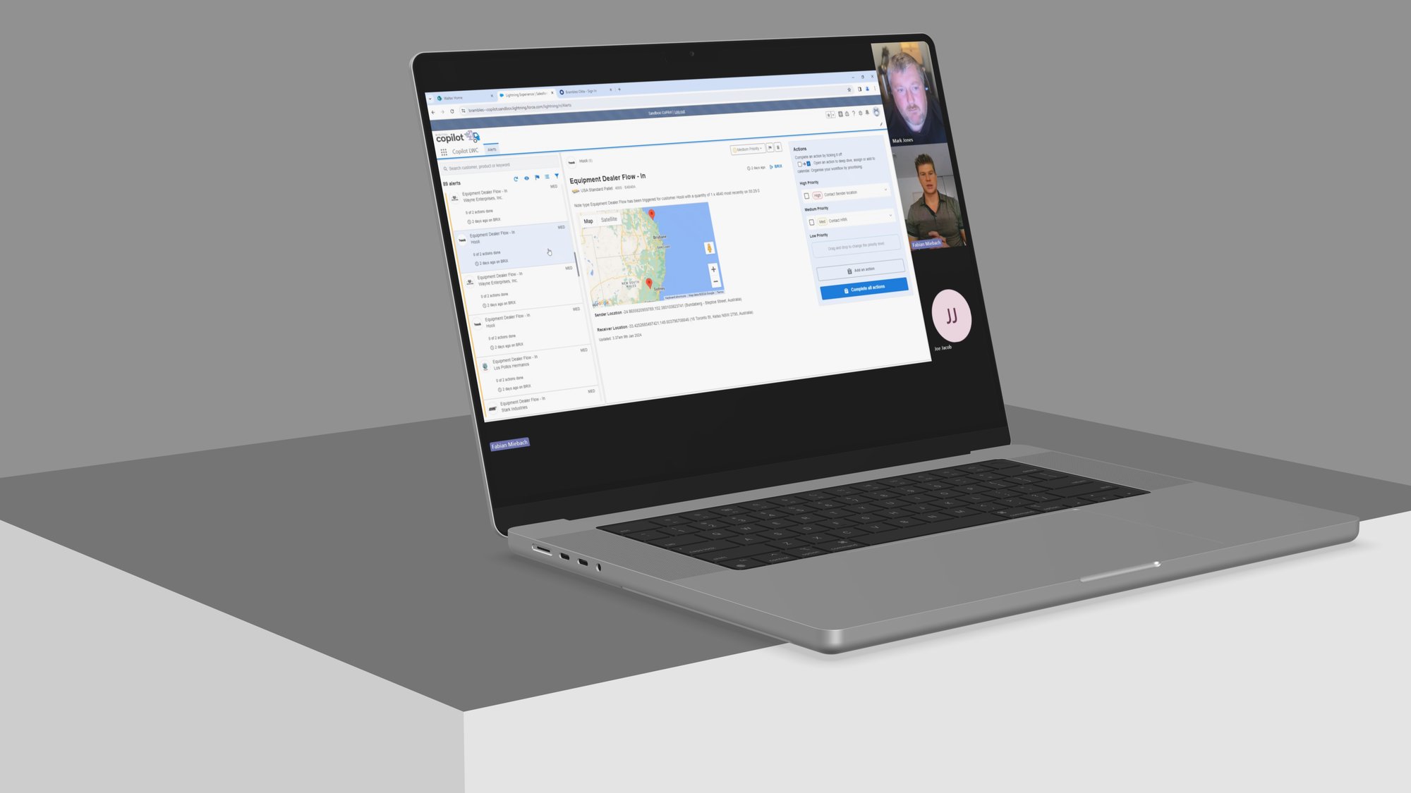 Remote usability session shown on a laptop, with a moderator reviewing an alert prioritisation screen alongside a research participant on a video call